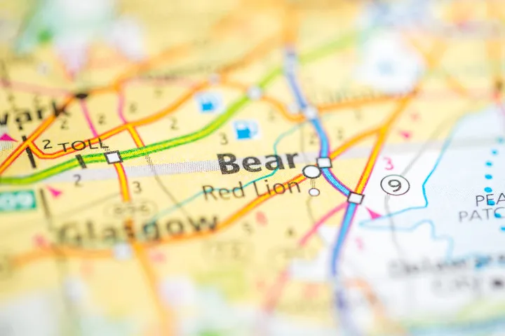 Close-up of a colorful printed map highlighting Bear and Red Lion locations with roads and route markers.
