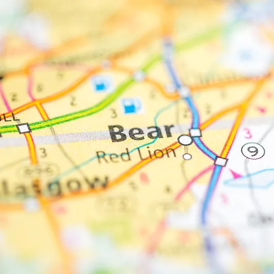 Close-up of a colorful printed map showing locations labeled "Bear" and "Red Lion.